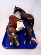 A tray of three Melba ware horse figures and a further Hereford bull figure