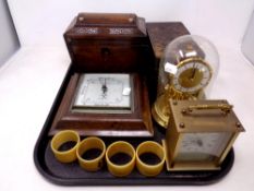 A tray of Regency rosewood and mother of pearl inlaid tea caddy, oak barometer, mantel clock,