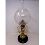 A 19th century German brass and glass oil lamp with chimney and shade