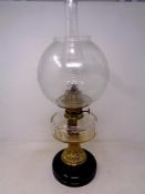 A 19th century German brass and glass oil lamp with chimney and shade