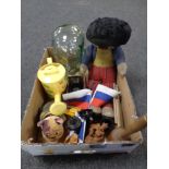 A box of vintage golly soft toy, glass head, flags on stands,