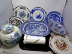 An antique transfer printed blue and white meat plate, further willow pattern plates,