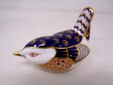 A Royal Crown Derby bird paperweight with gold stopper.