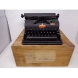 A Lilliput typewriter in original pine box