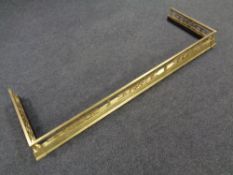 A pierced brass fender