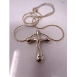 A sterling silver cross pendant on chain