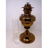 A 19th century brass oil lamp with chimney (as found)