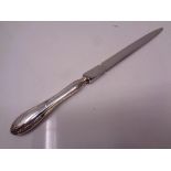 A silver handled letter opener