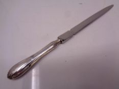 A silver handled letter opener