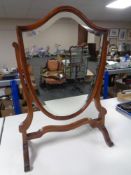 A shield shaped dressing table mirror