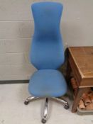 A high back office swivel chair in blue fabric