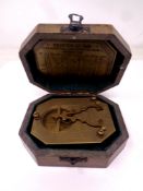 A reproduction F Cox of London brass sundial compass in fitted box.