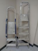 Two folding aluminium step ladders