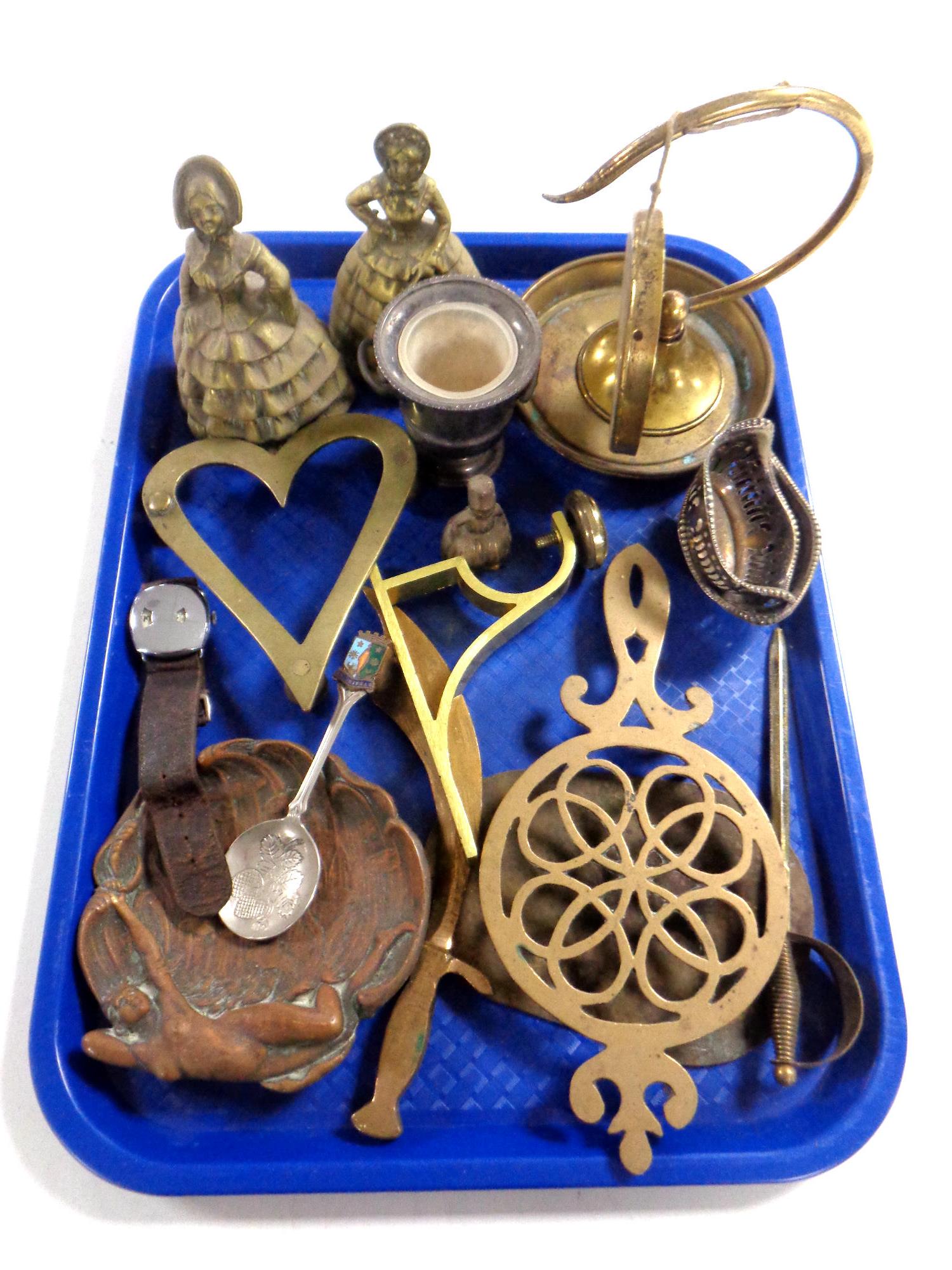 A tray of brass ornaments, bells, gong, trivet,