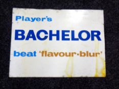 An enamelled sign - Player's bachelor beat flavour-blur