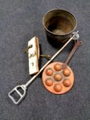 A copper pot containing antique door handle, shooting stick,