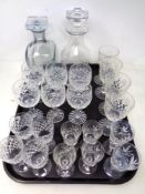 A tray of two decanters with stoppers and various sets of glasses including Thomas Webb etc