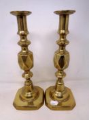A pair of Queen of Diamonds brass candlesticks, height 29 cm.