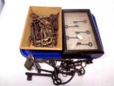 A box and display case containing a quantity of antique keys