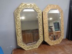 A pair of brass octagonal framed mirrors