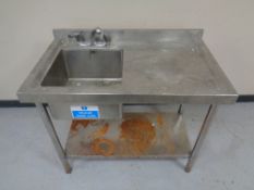 A stainless steel commercial sink unit