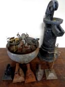A wooden water pump together with antique and later metal ware, light fitting, irons,