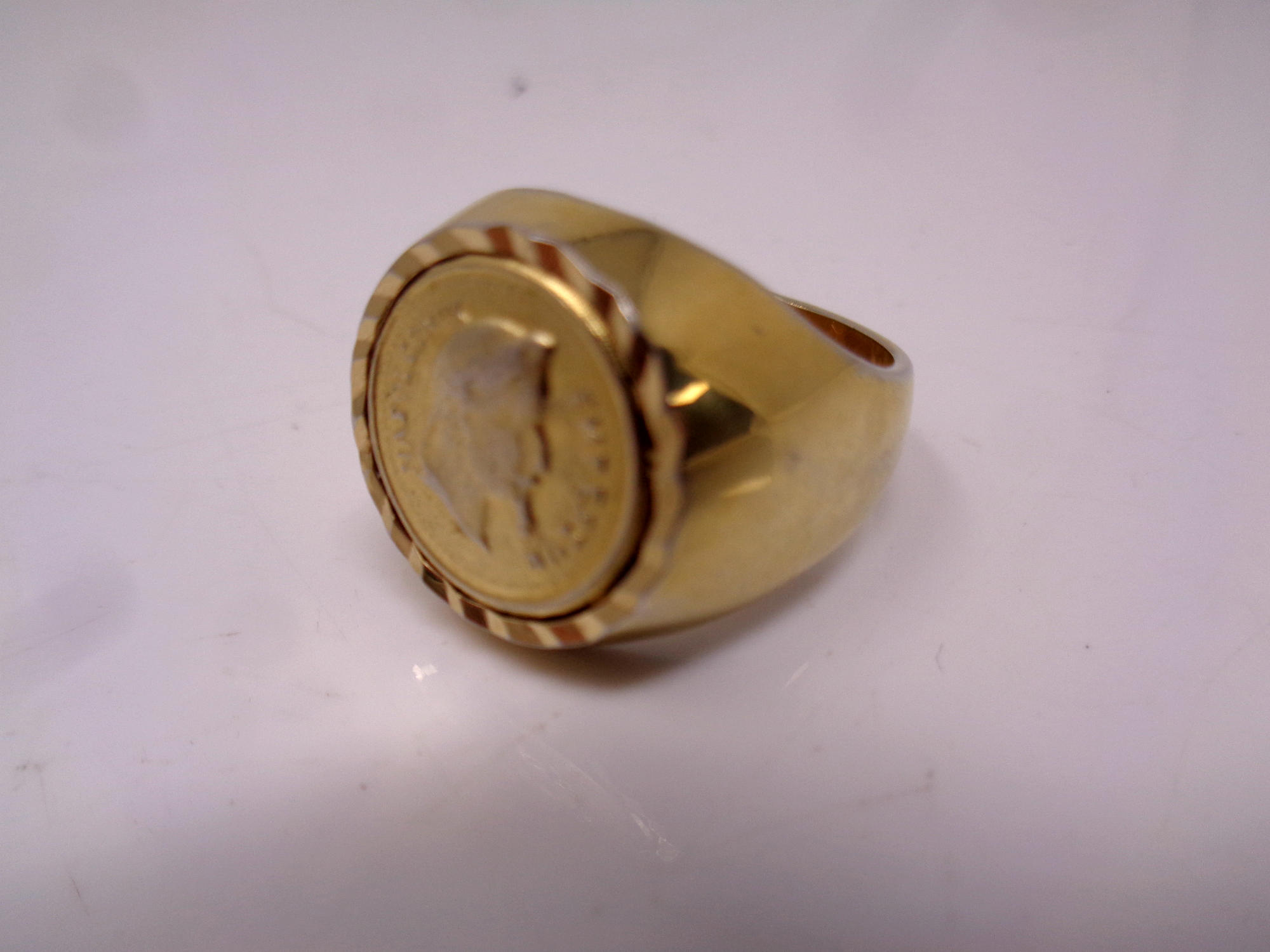 A gent's gilt metal coin ring.