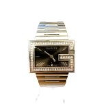 A Gentleman's Gucci wristwatch set with diamonds, the 58 diamonds approximately 1.4ct.