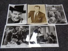 Photographs of John Wayne from films with Keystone, Globe, and Pictorial press stamps on verso.