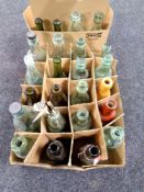 A collection of antique stoneware and glass bottles, ginger beer bottles,
