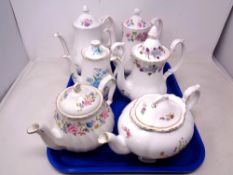 A tray of six porcelain tea pots including Sadler, Royal Albert,