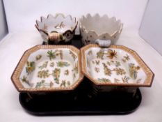 A tray of octagonal crackle glazed dishes raised on bracket feet,