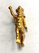 An antique yellow metal Cupid brooch