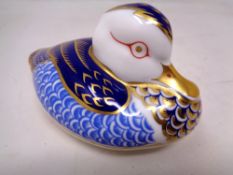 A Royal Crown Derby duck paperweight with gold stopper