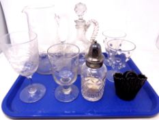 A tray of etched glass decanter and jug, sugar sifter,