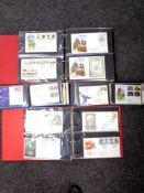 A box of four albums of first day covers