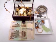 A box of costume jewellery, pair of silver and amber earrings, banknotes,
