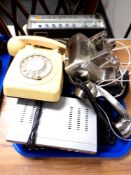 A tray of vintage telephone hand sets, Roberts radio,