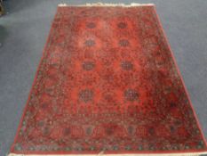 A machine made Afghan designed rug 253 cm x 170 cm