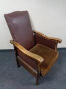 An Edwardian framed armchair in studded leather