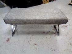 A contemporary stool on chrome support