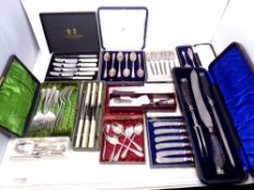 A tray of plated and stainless steel cutlery sets