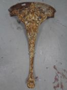 An ornate cast iron table support