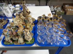 A tray of Leonardo Collection figures and a further tray of stainless steel goblets,
