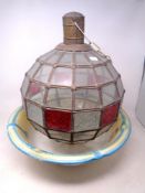 An antique pottery wash bowl together with a spherical glass pendant light shade