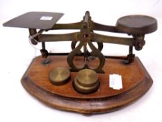 A set of antique postal scales with weights
