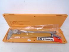 A Mitutoyo dial caliper, boxed.