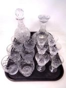 A tray of cut glass decanter with stopper, six rummers,