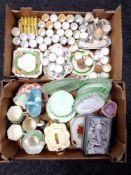 Two boxes of porcelain egg cups, Diamond china saucers,