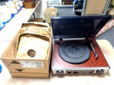 A contemporary turntable together with a box containing early 20th century records on labels